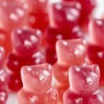 A pile of colorful, chewy sugar-free gummy bears in a small glass bowl.
