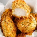 A plate of golden brown keto chicken nuggets with a side of ranch