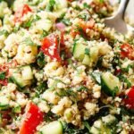 A bright bowl of Cauliflower Tabbouleh Salad with fresh parsley, mint, and tomatoes