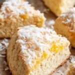 Golden brown coconut flour scones on a baking sheet with parchment paper