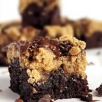 A stack of marbled chocolate and vanilla chickpea brookies with melted chocolate chips on top.