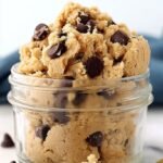 A bowl of smooth protein chickpea cookie dough topped with chocolate chips