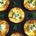 Golden brown cottage cheese egg bites in a silicone muffin tin