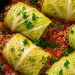 A bubbling skillet of ground beef, rice, and chopped cabbage in a savory tomato sauce.