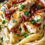 A bowl of creamy Chicken Carbonara Pasta with golden chicken and crispy pancetta