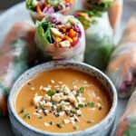 Fresh spring rolls filled with shrimp and vegetables served with peanut sauce