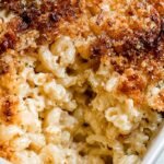 A golden brown casserole of Gruyere mac and cheese topped with crispy onions and fresh thyme.