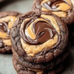 A close up of marbled chocolate and peanut butter cookies on a cooling rack.