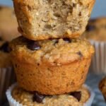 Golden brown oatmeal muffins with dark chocolate chips on a cooling rack