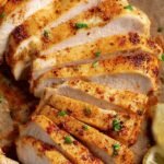 Golden brown thin sliced chicken breast cutlets in a heavy skillet