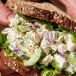 A bowl of creamy chicken salad made with Greek yogurt and fresh herbs