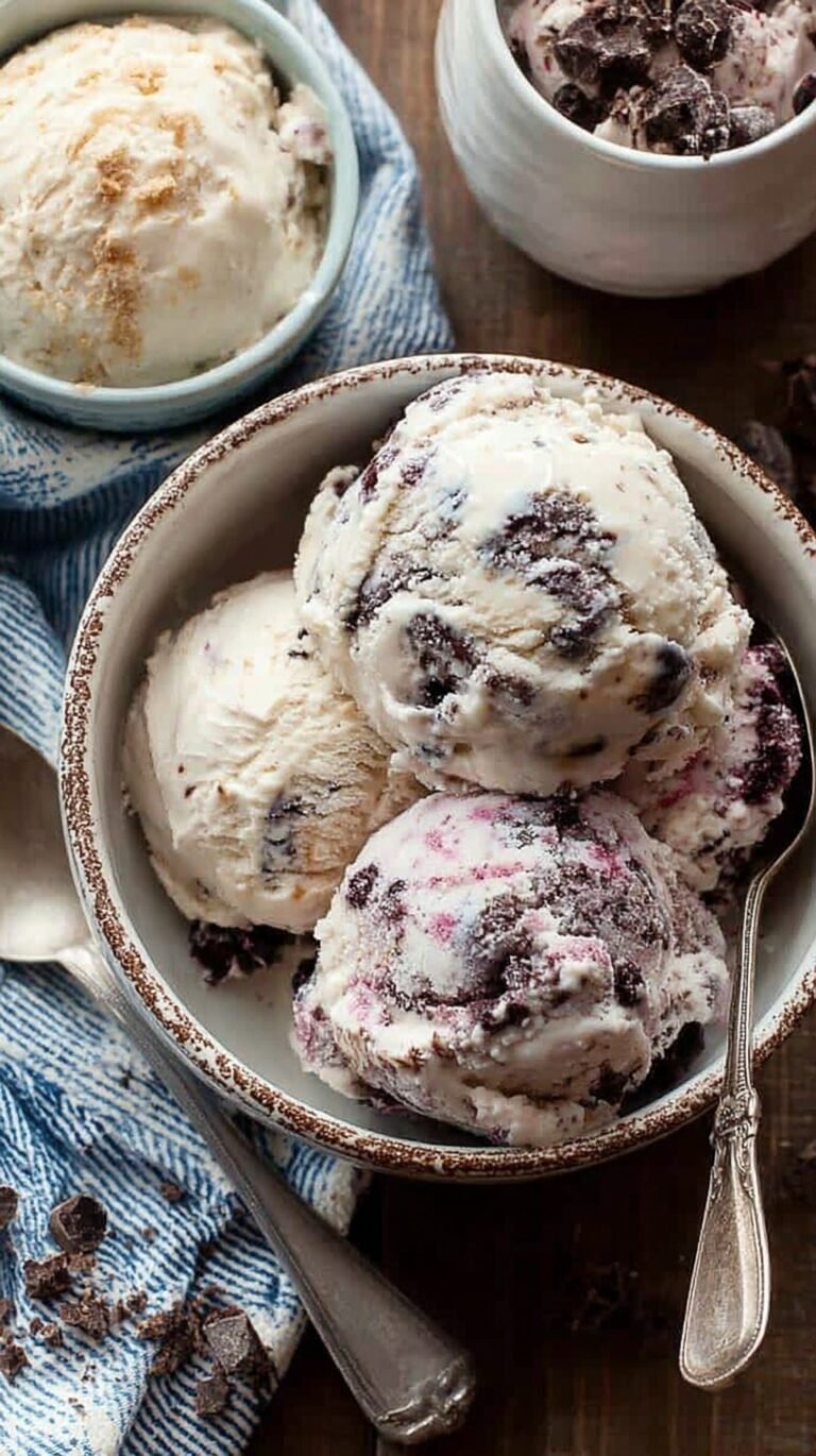 A bowl of creamy protein cottage cheese ice cream with dark chocolate chips on top.