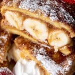 Golden brown brioche french toast stuffed with creamy peanut butter and dusted with cinnamon.