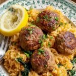 Golden turkey meatballs served over a bed of fluffy lemon-infused white rice with fresh parsley garnish.
