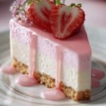 A creamy strawberry cheesecake with a bright red strawberry glaze and fresh fruit slices on top.