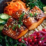 A vibrant crispy salmon bowl with avocado, cucumber, and spicy mayo drizzle on sushi rice.
