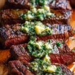 Sizzling Garlic Butter Brazilian Steak in a cast iron skillet with fresh parsley