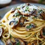 A bowl of Garlic Mushroom Pasta with sautéed mushrooms and fresh parsley