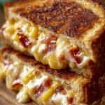 Golden brown toasted Hawaiian Pizza Grilled Cheese sandwich with melted mozzarella and pineapple.