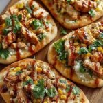 A crispy flatbread topped with sliced chicken, fresh romaine lettuce, and shaved parmesan cheese.