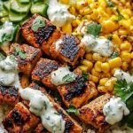 A vibrant Street Corn Chicken Bowl topped with cotija cheese and fresh cilantro