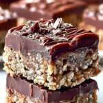 A tray of sliced chocolate oatmeal bars showing a dense and chewy texture