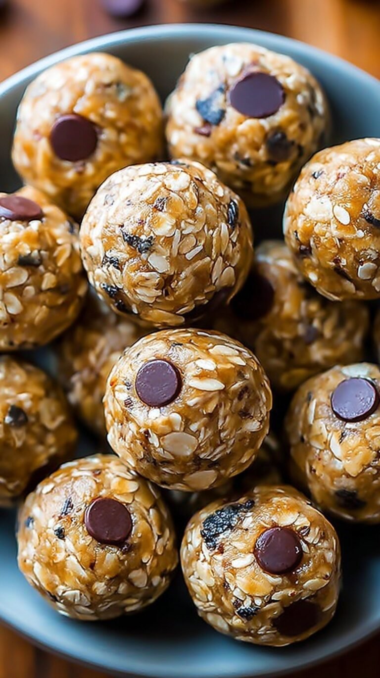A plate of round chocolate chip energy balls with oats and coconut
