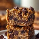 Golden brown protein chocolate chip lunchbox bars sliced into rectangles on a wooden board