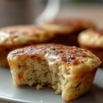 A tray of golden high-protein pancake bites with fresh blueberries on top.