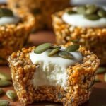 Frozen cottage cheese snack cups with pumpkin seeds and chocolate chips in a muffin tin