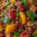A colorful skillet filled with sautéed ground turkey and vibrant diced bell peppers