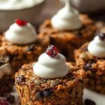 Jalapeño peppers filled with cheese and wrapped in prosciutto to look like mummies with olive eyes.