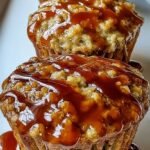 Golden brown breakfast pancake poppers in a mini muffin tin with chocolate chips