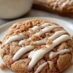 A stack of soft coffee cake cookies with cinnamon streusel and vanilla glaze drizzle