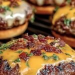 A juicy burger with melted cheddar, bacon, and ranch on a toasted brioche bun