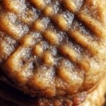 A plate of soft banana bread cookies with chopped walnuts and golden edges.