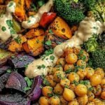 A colorful roasted veggie bowl with sweet potatoes, broccoli, and chickpeas over quinoa with tahini drizzle.